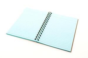 A blue notebook with a spiral bound spiral notebook photo