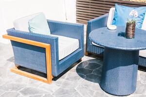 A blue wicker patio set photo