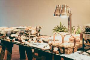 A buffet table with food and drinks on it photo