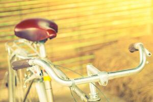 A bicycle with a red seat photo