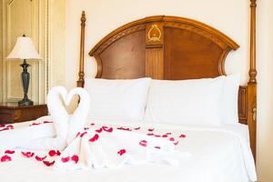 A bed with a white sheet photo