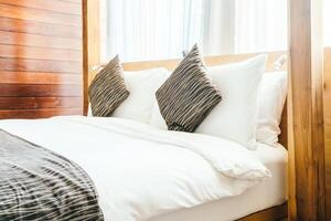 A bed with white sheets photo