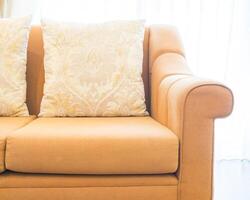 A close up of a couch with two pillows photo