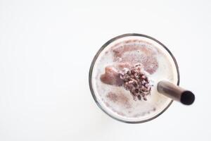 A chocolate milkshake with a straw in it photo