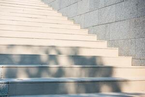 A close up of a set of stairs with a shadow photo