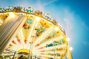 A carousel ride with lights on it photo