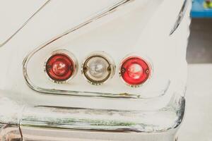 A close up of the tail lights of a classic car photo