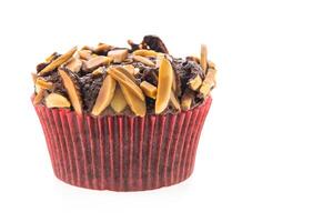 A cupcake with nuts and chocolate on top photo