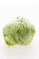 A lettuce is shown on a white background photo