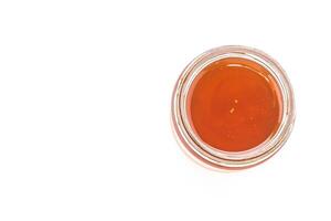 A jar of honey on a white background photo