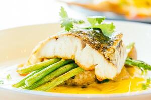 A plate of food with a fish on it photo