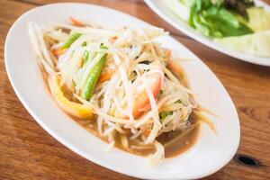 A plate of food with vegetables and meat on it photo