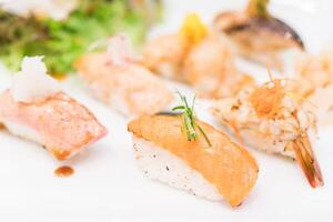 A plate of sushi with various types of fish photo