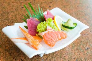 A plate of sushi with various types of fish photo