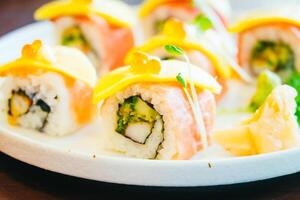 A plate of sushi with a variety of toppings photo