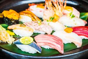A plate of sushi with various types of fish photo