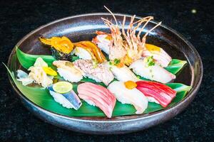 A plate of sushi with various types of fish photo