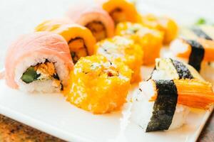 A plate of sushi with different colors photo