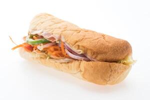 A sandwich with meat, vegetables and cheese photo