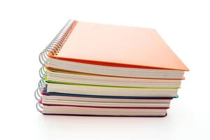 A stack of colorful notebooks on a white background photo