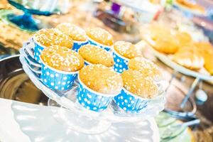 A table with cupcakes on it photo