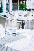 A table with a glass of wine and a napkin photo