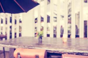 A table with chairs and an umbrella photo