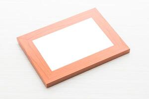 A wooden frame with a blank white sheet on top photo