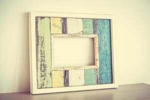 A wooden frame with a colorful paint on it photo