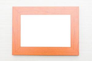 A wooden frame with a blank white paper on it photo