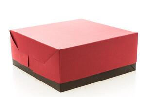 Red box with black lid on white background photo