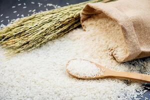Rice and a bag of rice on a table photo