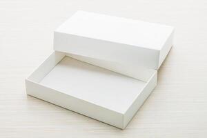 White box with empty space on wooden surface photo
