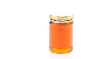 A jar of honey on a white background photo
