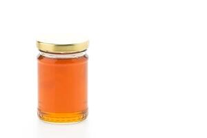 A jar of honey on a white background photo