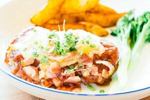 A plate of food with a side of potatoes photo