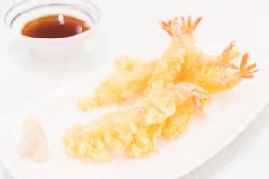 A plate with fried shrimp and dipping sauce photo