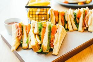 A tray with sandwiches and fries on it photo
