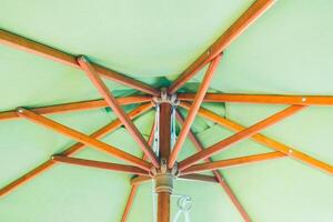 A view of a green umbrella from above photo