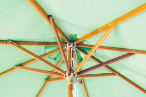 A view of a green umbrella from above photo