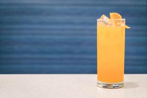 Orange and lime cocktail with a splash of soda photo