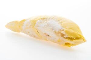 A peeled yellow fruit on a white background photo