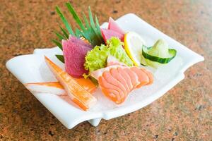 A plate with various types of sushi on it photo