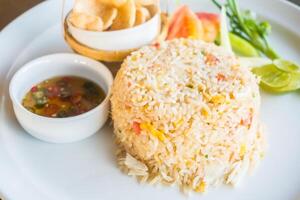 A plate with rice and vegetables on it photo