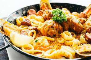A pan with seafood and pasta in it photo