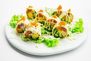 A plate with sushi rolls on it photo