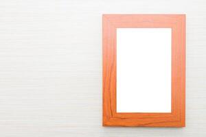 An empty wooden frame on a white background photo