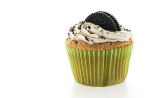 An oreo cupcake with cream and white frosting photo