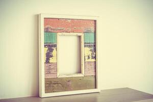 A wooden frame with a colorful paint on it photo