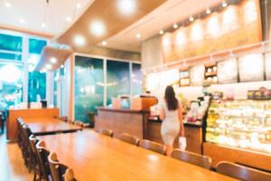 A woman is standing in front of a restaurant photo